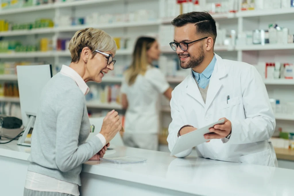 A pharmacist speaking with a patient